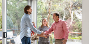 shaking hands with Elders real estate agent